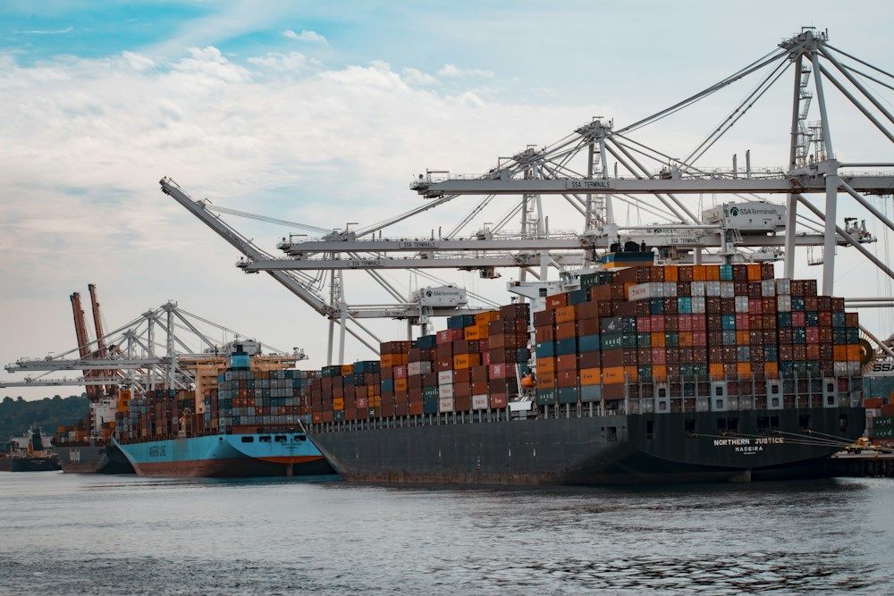 Shipping containers moving through a global port